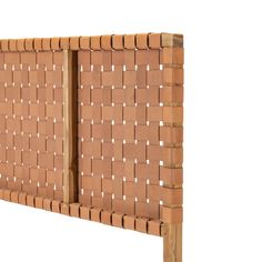 a close up of a wooden headboard made out of bricks