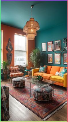 a living room filled with lots of furniture and paintings on the wall next to a window