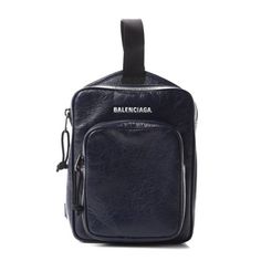 This backpack from Balenciaga is crafted with the brand's signature crinkle Arena leather. The zipper closure opens up to a black fabric lined interior and the front of the bag features a zipper compartment, providing ample organization. The adjustable strap is conveniently worn on one shoulder. This backpack is perfect for everyday errands, with the distinctive style and quality of Balenciaga! Model number: 620260 Color: Dark blue Arena crinkle leather White Balenciaga logo Zipper closure Black Balenciaga Arena, Leather Travel Backpack, White Balenciaga, Red Backpack, Balenciaga Logo, Balenciaga Black, Backpack Brands, Balenciaga Bag, Backpack Bag