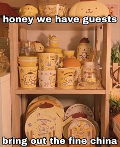 the shelves are filled with dishes and other decorative items in yellow, white and brown colors