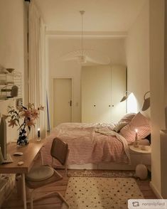 a bedroom with a bed, desk and mirror