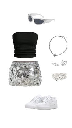 a skirt, top and shoes are arranged in the shape of an outfit with silver sequins