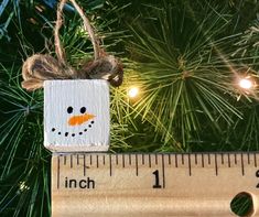 This listing is for a Set of 10 MINIATURE snowmen ornaments. These miniature snowmen are sold in sets of 10 and are perfect for your miniature Christmas tree, to use as decorative gift tags, give as gifts, stocking suffers, party favors, or more!  The possibilities are endless.  They are individually hand painted and are completed with a jute thread and bow.   Please note the size - these are MINIATURE snowmen.  Each snowman is approximately 5/8 inch x 5/8 inch x 5/8 inch. You can find more craf Button Pictures, Stocking Suffers, Miniature Snowman, Miniature Christmas Tree, Snowmen Ornaments, Miniature Christmas Trees, Glendale Az, Button Picture, Mini Christmas Tree