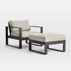 a chair and ottoman sitting next to each other on a white surface with no one in it