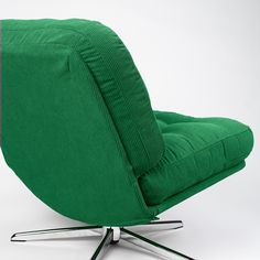 a green chair sitting on top of a metal base