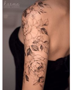 a woman's arm with flowers on it