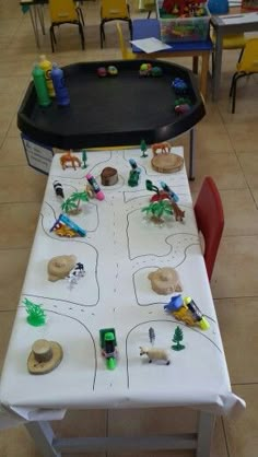 a child's play table with toys on it