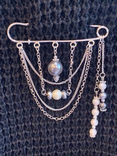 Handmade pretty safety pin brooch with mixture of glass and plastic pearls/beads.  I HAVE OTHER BROOCHES https://www.etsy.com/uk/listing/1325530078 https://www.etsy.com/uk/listing/1325533936 https://www.etsy.com/uk/listing/1418340543 Size: Approx 75mm long, 21mm wide, hole: 3mm Any questions please let me know!  Thank you for shopping with my small business.  Every order is really appreciated. Where possible I use recyclable or biodegradable materials in my packaging. Handmade Safety Pin, Safety Pin Brooch Diy, Kilt Pin Jewelry, Safety Pin Jewelry Patterns, Beaded Pins, Kilt Pin Brooches, Handmade Jewelry Business, Safety Pin Jewelry, Biodegradable Materials