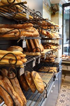 a bakery filled with lots of different types of bread