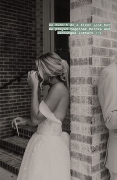 a woman in a wedding dress standing next to a man