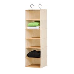 three tiered shelf with two coats and one pair of shoes