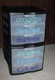 three plastic drawers stacked on top of each other with words written on the bottom and bottom