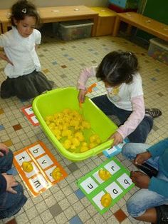 children playing with letters and numbers in a classroom