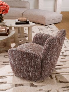 a living room with a couch, chair and coffee table