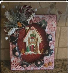 a gingerbread house is decorated with candy canes