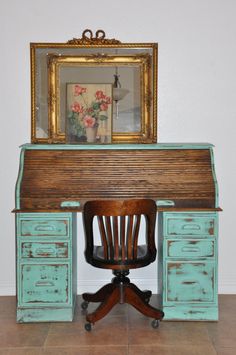 an old wooden desk with a chair underneath it