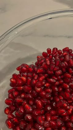 pomegranate in a glass bowl on a table