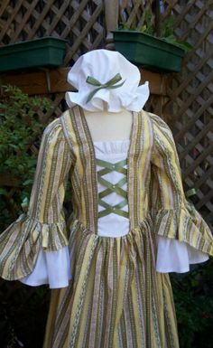 "SAMPLE FABRIC IS SOLD OUT...BUT IT SHOWS THE SLEEVES PERFECT PLEASE READ FULL AD: To view all the colonial dresses at once : https://www.etsy.com/shop/AshleysAttic?section_id=10247808&ref=shopsection_leftnav_1 This is the perfect dress for girls with sensitive skin who want something pretty but cannot stand any lace against their skin even softer lace.. this dress is made of 100 percent cotton calico in nice prints , stomacher with crossed satin ribbons caught by costume pearls. above the stoma American Classroom, Colonial Dresses, 1700s Dresses, Colonial Clothing, Colonial Costume, Colonial Dress, Kawaii Clothes Goth, Historical Dress, Girls Costumes