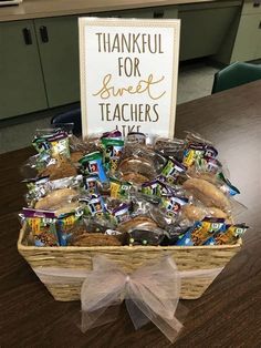 a thank you teacher gift basket on a table with a sign that reads, thanks for sweet teachers take