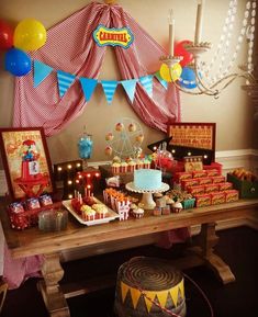 a circus themed birthday party with balloons and cake