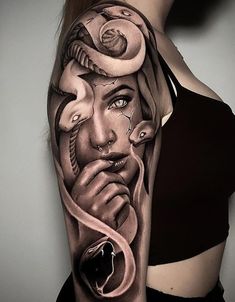 a woman's arm with an artistic tattoo design on the side of her body