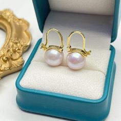 Discover the essence of modern elegance with our Freshwater Pearl Bucket-Shaped Earrings. Each piece features a captivating 11-12mm round freshwater pearl of AAA quality, exuding classic sophistication. Meticulously crafted in 925 sterling silver, with an option for 18k gold vermeil, these earrings showcase a sleek, contemporary design. The distinctive bucket shape combines a minimalist approach with the timeless allure of pearls, creating a versatile accessory ideal for any ensemble. A perfect Elegant High Luster Pearl Earrings Gift, Akoya Pearl Earrings For Anniversary, Elegant Pearl White Earrings With High Luster, Elegant Pearl White Earrings Gift, Exquisite Round Pearl Earrings For Formal Occasions, Elegant Round Pearl Earrings For Formal Occasions, Elegant Round Everyday Luxury Earrings, Elegant Everyday Luxury Round Earrings, Elegant Round Pearl Earrings With High Luster