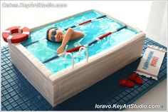 a cake made to look like a woman swimming in a pool with life preservers