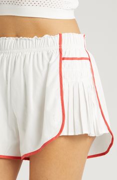 Work out or chill out in these sporty shorts designed with pleated sides for eye-catching dimension. 3" inseam; 40" leg opening; 12 1/2" front rise; 16 1/2" back rise (size Medium) Elastic waist Lined gusset 100% polyester Machine wash, tumble dry Imported Preppy Active Wear, Activewear Trends 2024, Luxury Athleisure, Spring Athleisure, Sporty Set, Unisex Looks, Sports Clothes, Sporty Shorts, Easy Tiger