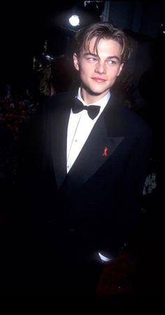 a young man in a tuxedo and bow tie