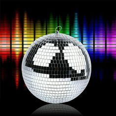 a disco ball with an upside down symbol on it in front of colorful sound waves