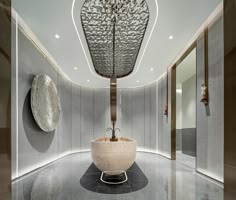 a large bath tub sitting inside of a bathroom next to a wall mounted faucet