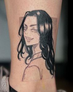 a woman's leg with a black and white drawing of her face on it