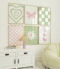 a living room with pictures on the wall and a chair in front of a table