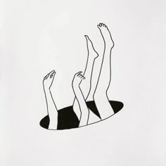 three people laying on top of each other with their hands in the air above them