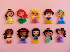 the princesses are made out of perler beads and have different designs on them