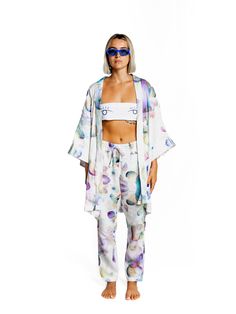 Be Like Water Kimono - Handcrafted Wearable Art Rock your summer boat in effortless elegance wearing the Be Like Water kimono, designed by German artist Ole Ukena and hand-produced by his studio team in Ubud, Bali. This delicate piece is part of Ole's watercolor series, where each design is scanned and printed to create beautiful, flowing colors that blend seamlessly into each other, just like the shapes and forms in the artwork. Crafted with Care Each kimono is a labor of love, created with the Casual Silk Kimono For Spring, Casual Silk Spring Kimono, Casual Silk Kimono For Summer, White Relaxed Fit Kimono With Kimono Sleeves, Summer Silk Wrap Kimono, Summer White Silk Kimono, Casual Summer Kimono For Daywear, White Silk Kimono For Summer, White Relaxed Fit Kimono For Spring