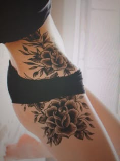 a woman's stomach with flowers on it and the words top 10 hip tattoo designs