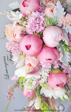 a bouquet of pink flowers and greenery