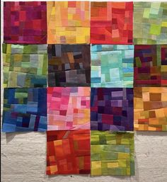 an art piece made out of different colored squares