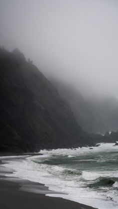 the beach is covered in fog and water