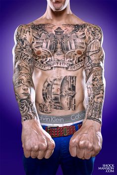 a man with many tattoos on his chest and arms is standing in front of a purple background