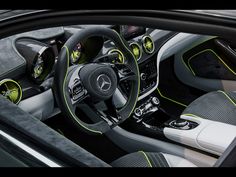 the interior of a mercedes c - class coupe with green stitching and black leather