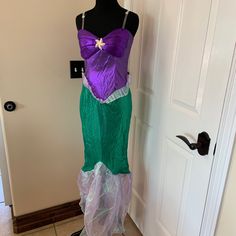 a dress made to look like a mermaid with purple and green underskirts