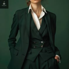 Elevate your professional wardrobe with our women's Three-piece office suit in a captivating green hue, exuding confidence and sophistication. This meticulously crafted ensemble features a tailored jacket and coordinating trousers, perfect for making a statement in the corporate world. The jacket boasts a timeless design with peaked lapels, adding a touch of authority and elegance to your office attire. The peaked lapels, featuring pointed edges that ascend towards the shoulders, create a flatte Blouses For Suits Women, Suit Elegant Woman, 1920s Suits Women, Pantsuit Outfits For Women, Dark Green Womens Suit, Gender Neutral Black Tie Outfit, Three Piece Women’s Suit, Tailored Suits Women, Gender Neutral Formal Outfit