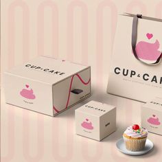 the cupcake box is next to two boxes