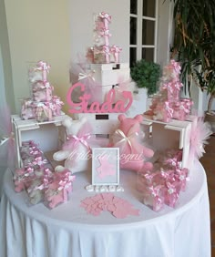 a table topped with pink and white decorations