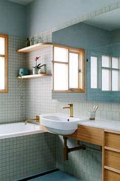 a bathroom with two sinks and a bathtub