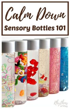 the bottles are filled with different colored liquids and have cartoon characters painted on them