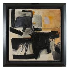 an abstract painting with black and white colors on the wall, framed in wood frame