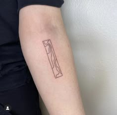 a woman's arm with a small knife tattoo on the left side of her arm